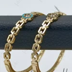 دستبند طلای النگویی هیدروگراف با مینای مشکی