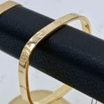 دستبند النگویی طلای چهارضلعی اینه ای زرد طرح کارتیه برند ، کارتیه لاو (کارتیه مارلیک)